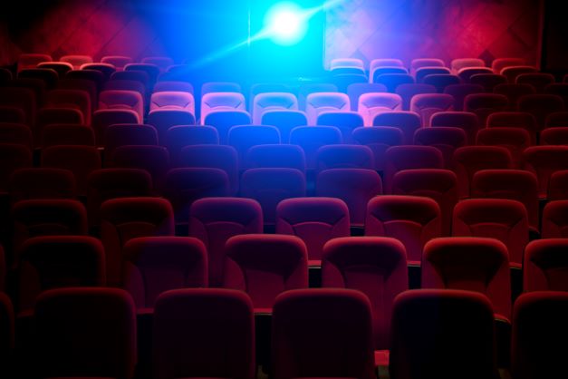 Backlit photo of a theater full of empty seats